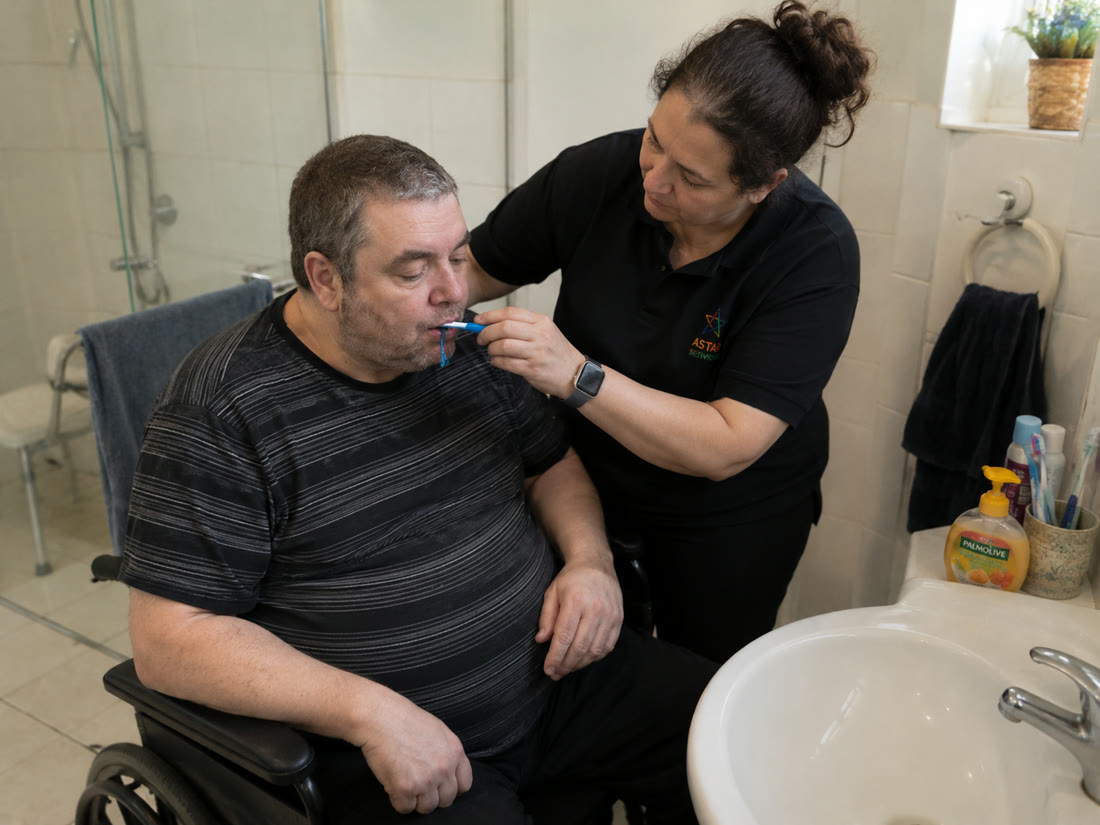 A support worker sharing a warm moment with a participant
